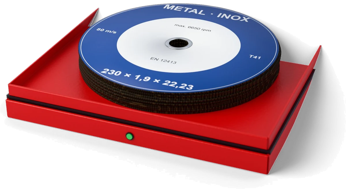 Red Inostorage weighing cell with a stack of cutting discs on the tray and the green LED on the front